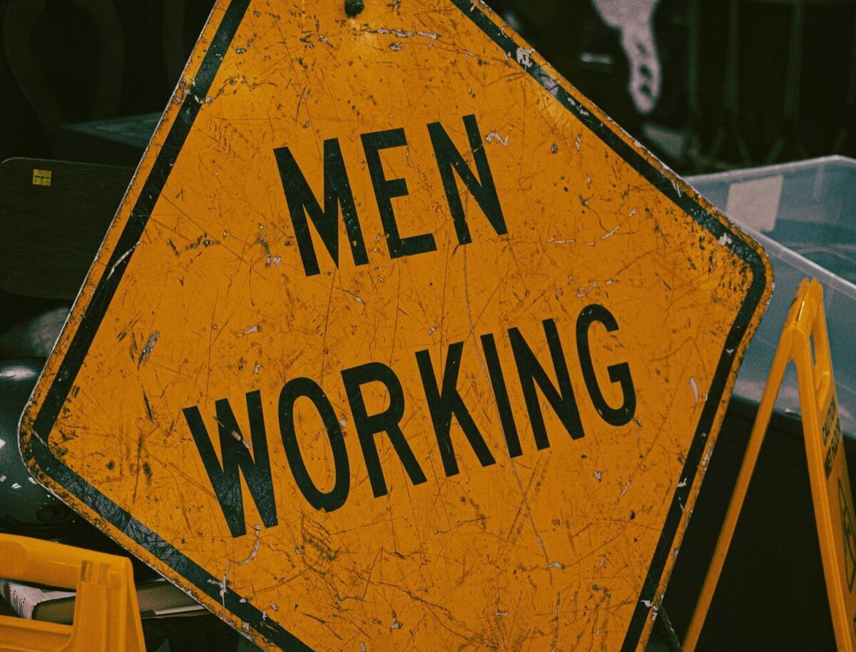 Men Working Sign